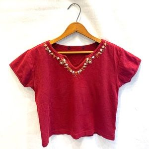 Red T-shirt with flower embellishments